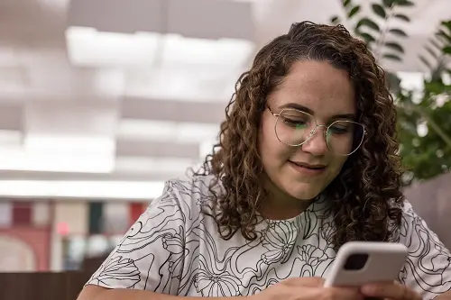 A woman looking at her phone